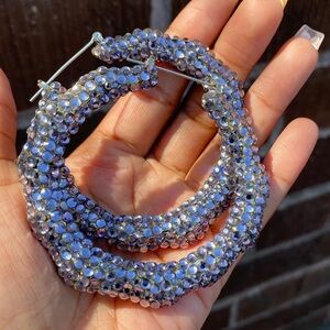 Lavender bedazzled bamboo hoop earring. About 3in across